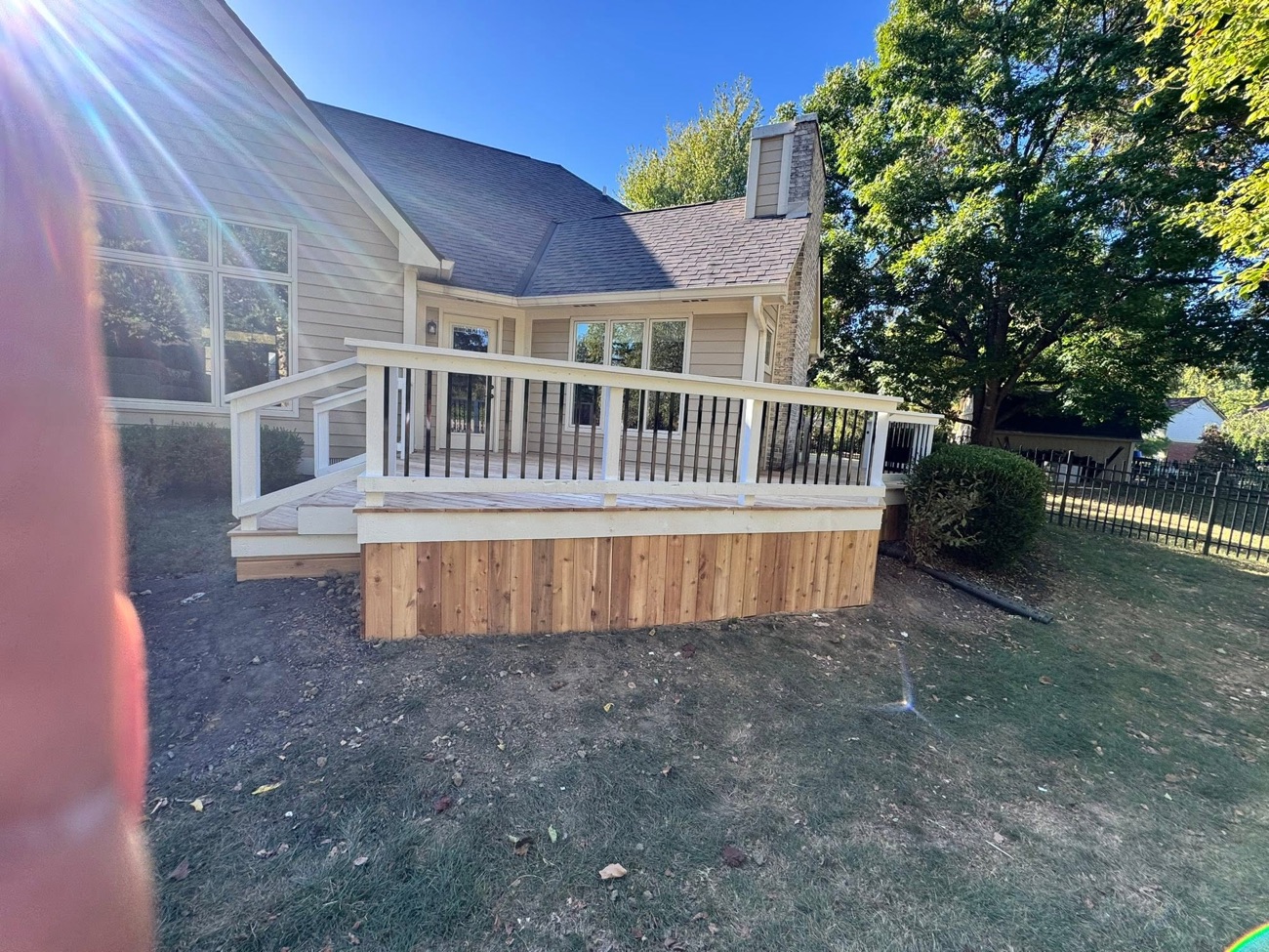 Finished custom wood deck with railing