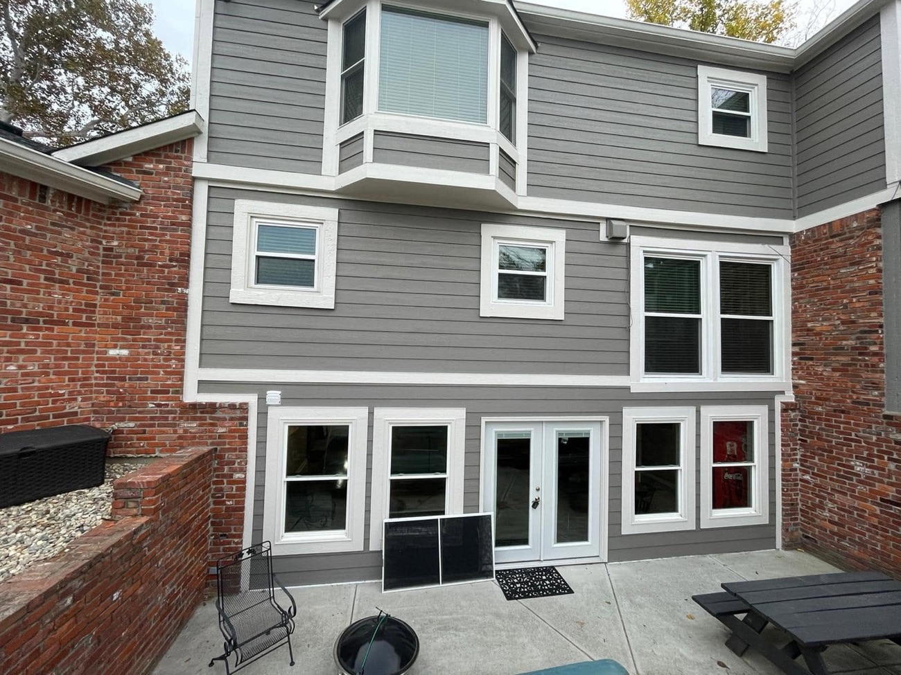 Home exterior with new siding, windows and white trim